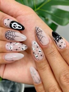 Halloween themed nails in black and white