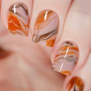 earth toned water marble nails